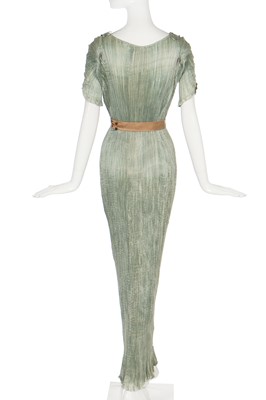 Lot 57 - A Mariano Fortuny pale-aqua pleated silk Delphos gown, 1920-30