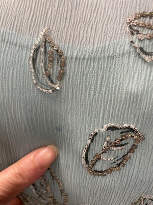 Lot 63 - A flapper dress of pale sea-blue crêpe chiffon, circa 1929