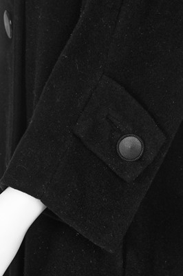 Lot 83 - A Christian Dior by Yves Saint Laurent couture black wool tent coat, 1958-60