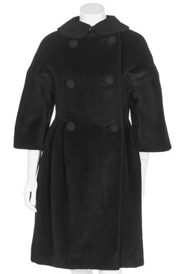 Lot 87 - An American licensed copy of a Balenciaga black wool coat, circa 1960