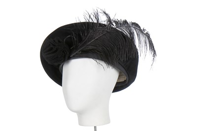 Lot 235 - A Vivienne Westwood black velvet hat with tulle veil to rear, circa 2008