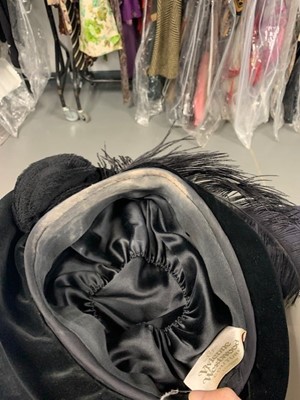 Lot 235 - A Vivienne Westwood black velvet hat with tulle veil to rear, circa 2008