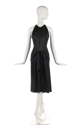 Lot 353 - An Yves Saint Laurent couture black satin evening gown, 1982