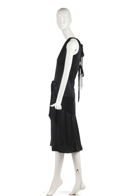 Lot 353 - An Yves Saint Laurent couture black satin evening gown, 1982