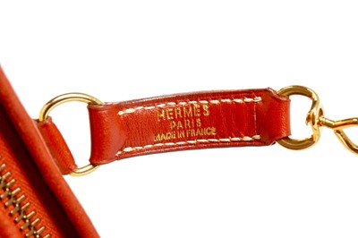 Lot 125 - An Hermès straw and brick-red-brown leather Trim bag, probably 1990s