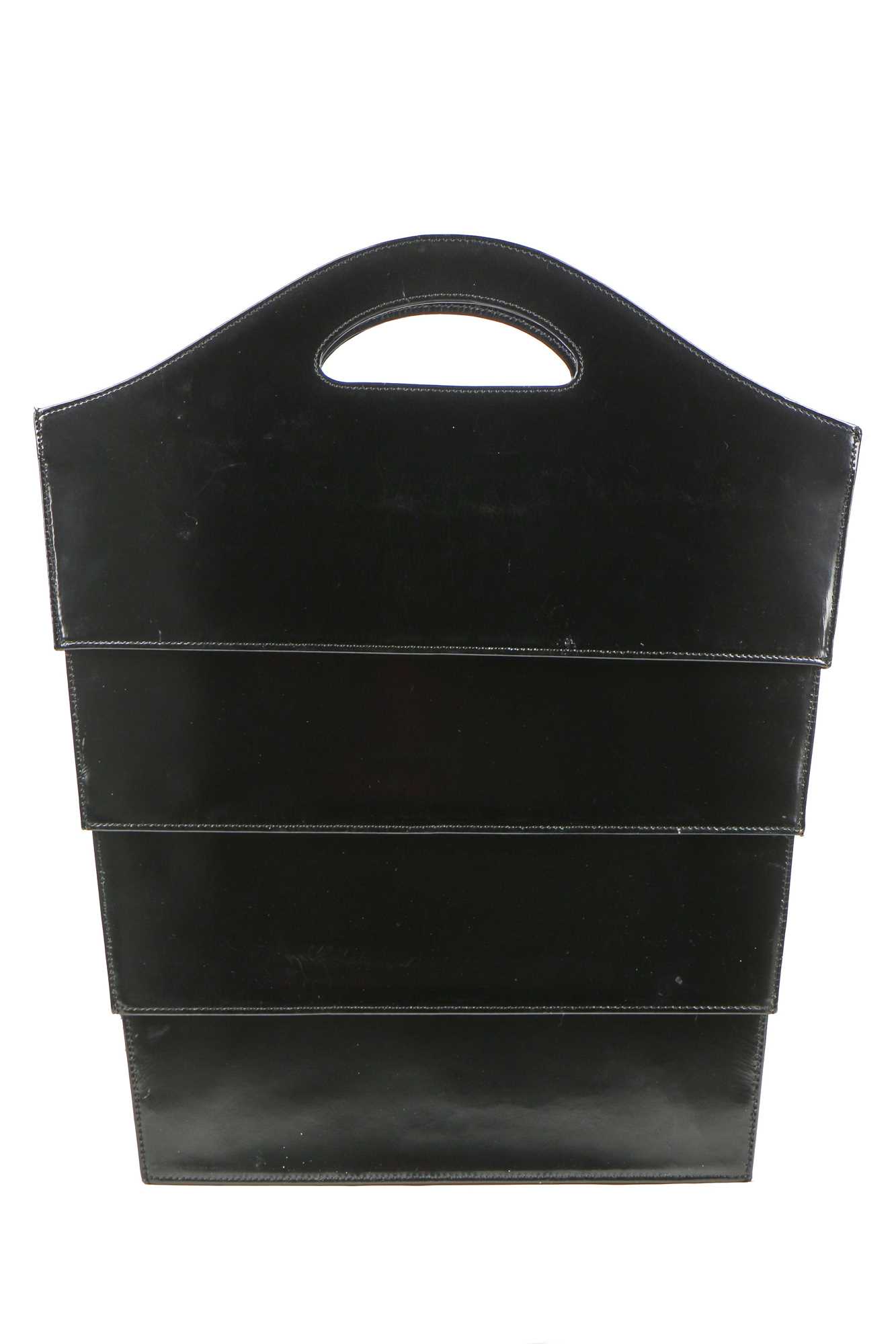 Lot 142 - An Issey Miyake 2D collapsible black patent bag, modern