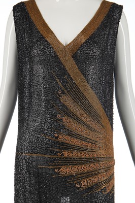 Lot 244 - A black and gold beaded flapper dress, 1928-29