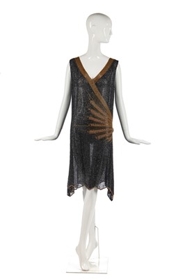 Lot 244 - A black and gold beaded flapper dress, 1928-29