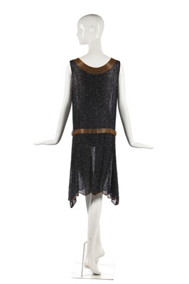 Lot 244 - A black and gold beaded flapper dress, 1928-29