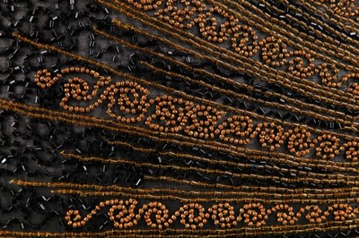 Lot 244 - A black and gold beaded flapper dress, 1928-29