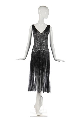 Lot 259 - A finely-beaded tulle evening gown, circa 1930