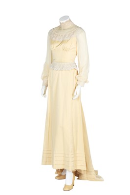 Lot 257 - A primrose-yellow wedding gown trimmed with Point de Gaze lace, c.1970