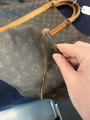 Sold at Auction: A Louis Vuitton monogram canvas suit carrier 60 with Vachetta  leather handle and trim, gold tone hardware