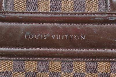 Lot 120 - A Louis Vuitton Damier Ebène canvas and leather holdall