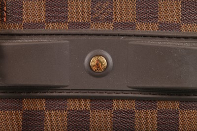 Lot 118 - A Louis Vuitton Pégase Damier Ebène canvas and leather suitcase