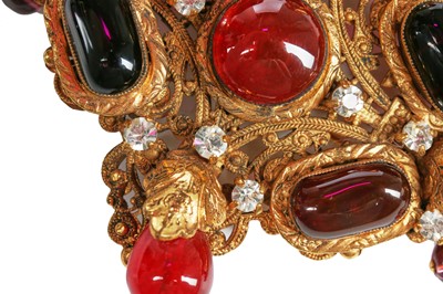 Lot 147 - A Chanel gilt brooch/pendant inset with cabochon glass 'rubies', 1970s