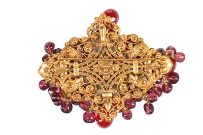 Lot 147 - A Chanel gilt brooch/pendant inset with cabochon glass 'rubies', 1970s