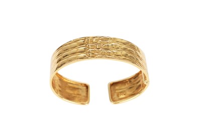 Lot 49 - A Gucci 18K gold cuff-bracelet, 1980s