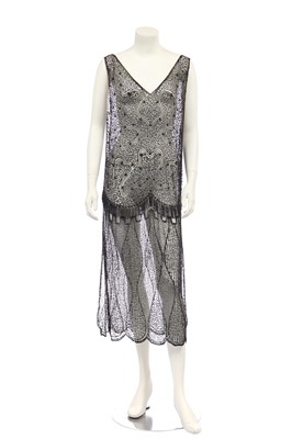 Lot 397 - A sequined and beaded black tulle tabard, early 1920s