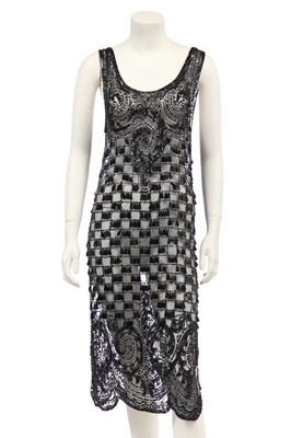 Lot 396 - A black tulle dress embellished with droplet-paillettes, 1920s