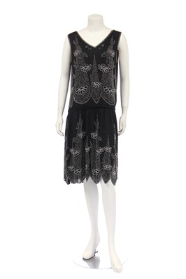 Lot 394 - A beaded black silk-crêpe flapper dress, circa 1924