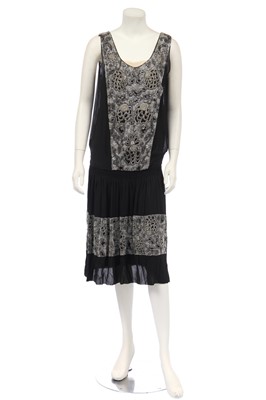 Lot 393 - A black chiffon flapper dress beaded with chrysanthemum motif, circa 1924