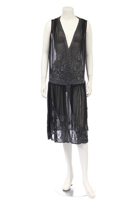 Lot 392 - A black chiffon flapper dress beaded with stylized floral sprays, circa 1924