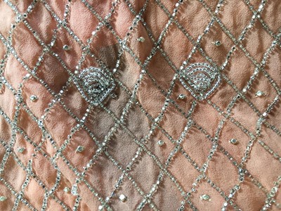 Lot 381 - A beaded peach chiffon flapper dress, circa 1925