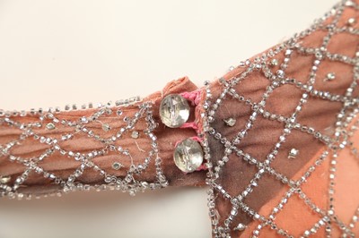 Lot 381 - A beaded peach chiffon flapper dress, circa 1925