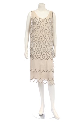 Lot 384 - An embellished ivory chiffon flapper dress, late 1920s