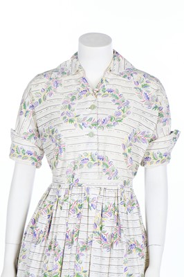 Lot 297 - A large group of mainly floral printed summer fashions, 1940s-1950s