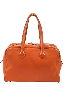 Lot 72 - An Hermès orange clemence leather Victoria II 35, 2007