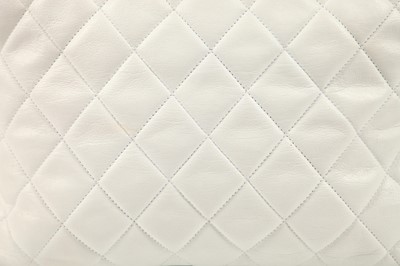 Lot 12 - A Chanel quilted white leather bag with navy leather accents, 1989-1991