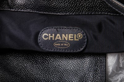 Lot 15 - A Chanel navy leather bucket bag with leather shoulder strap, 1994-1997