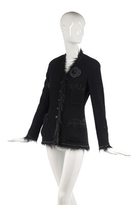Lot 27 - A Chanel black bouclé wool single-breasted jacket, 1990s