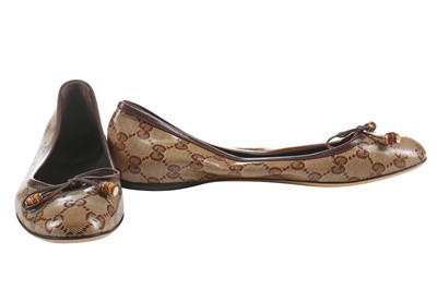 Lot 74 - A pair of Gucci monogrammed and embossed leather ballet pumps, 2010s