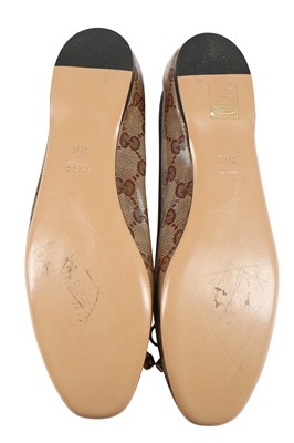 Lot 74 - A pair of Gucci monogrammed and embossed leather ballet pumps, 2010s