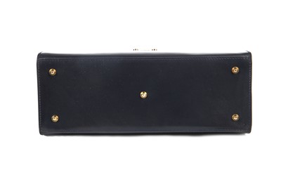 Lot 101 - A Gucci navy leather handbag, 1980s
