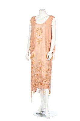 Lot 352 - A beaded peach chiffon flapper dress, 1920s