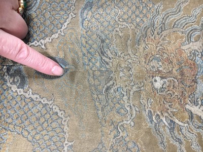 Lot 473 - A brocaded satin dragon robe, jifu, Chinese, Qing dynasty, second half of the 18th century