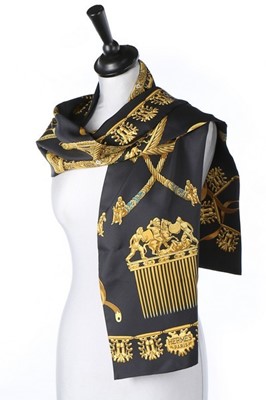 Lot 29 - An Hermès 'Les Cavaliers D'Or' long silk scarf,...