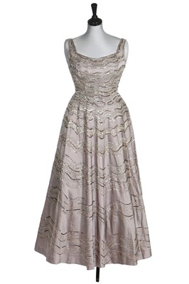Lot 292 - Gracie Fields' embellished silver satin evening gown, 1956