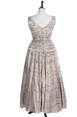 Lot 292 - Gracie Fields' embellished silver satin evening gown, 1956