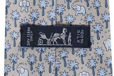 Lot 206 - Four Hermès printed silk ties in shades of blue and gold, modern