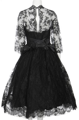 Lot 293 - A Norman Hartnell couture black Chantilly cocktail dress, circa 1955