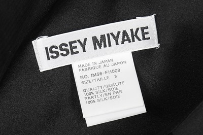 Lot 211 - An Issey Miyake black satin and stockinette evening dress, late 1990s