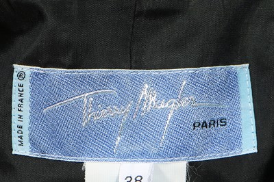 Lot 184 - A Thierry Mugler black gabardine suit with sheer insertions, Spring-Summer 1998