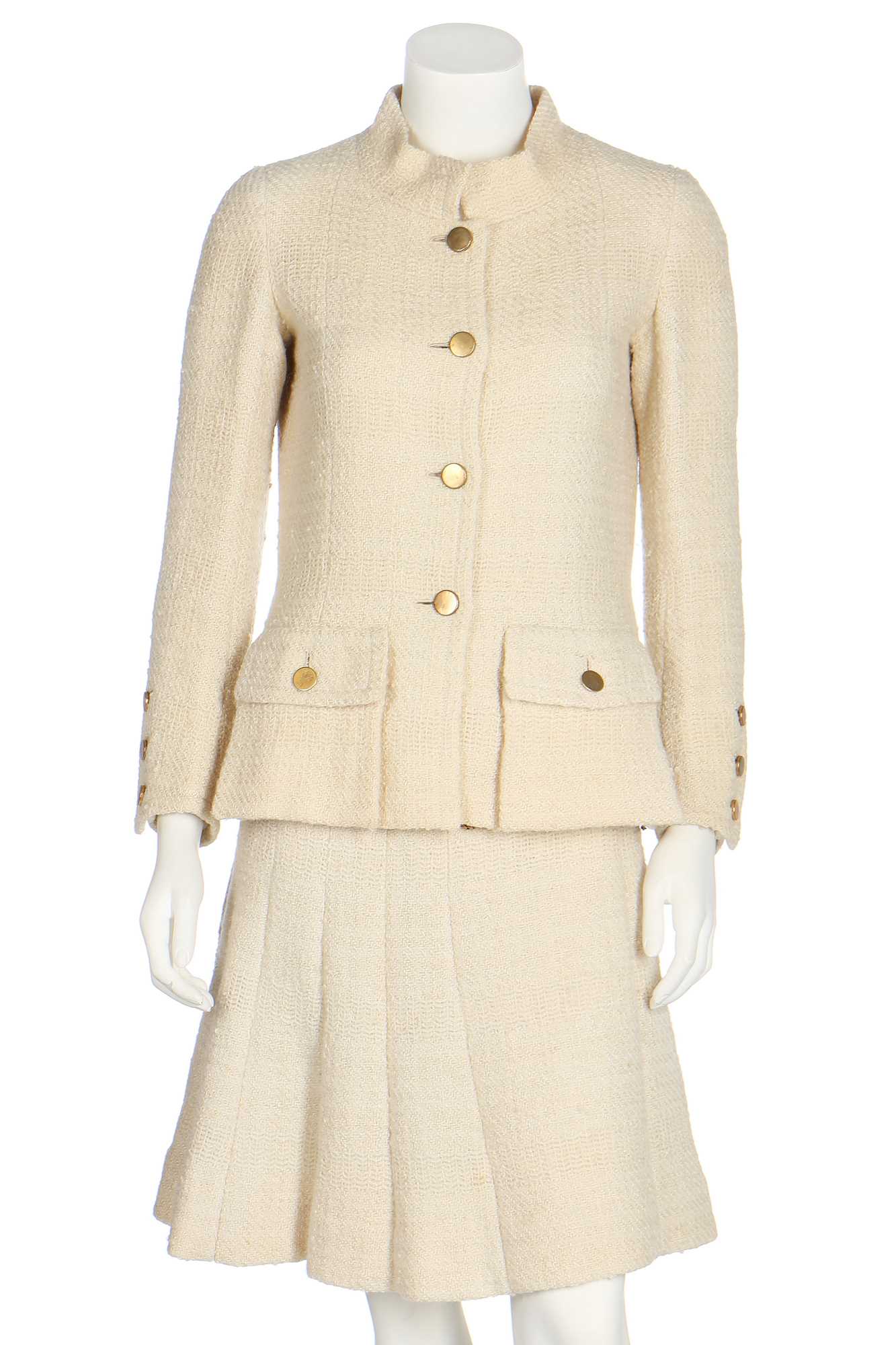 Lot 50 - A Chanel couture ivory tweed suit, 1968,