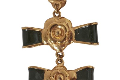Lot 48 - A pair of Chanel enamelled gilt metal 'bow' clip-on earrings, circa 1984
