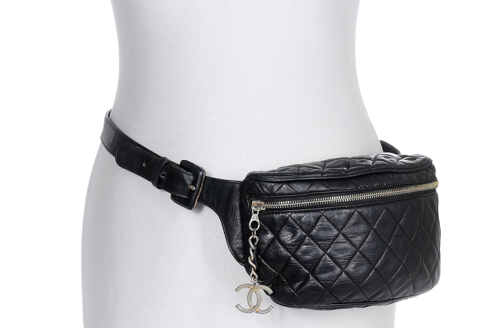 Lot 66 - A Chanel quilted navy lambskin leather bumbag